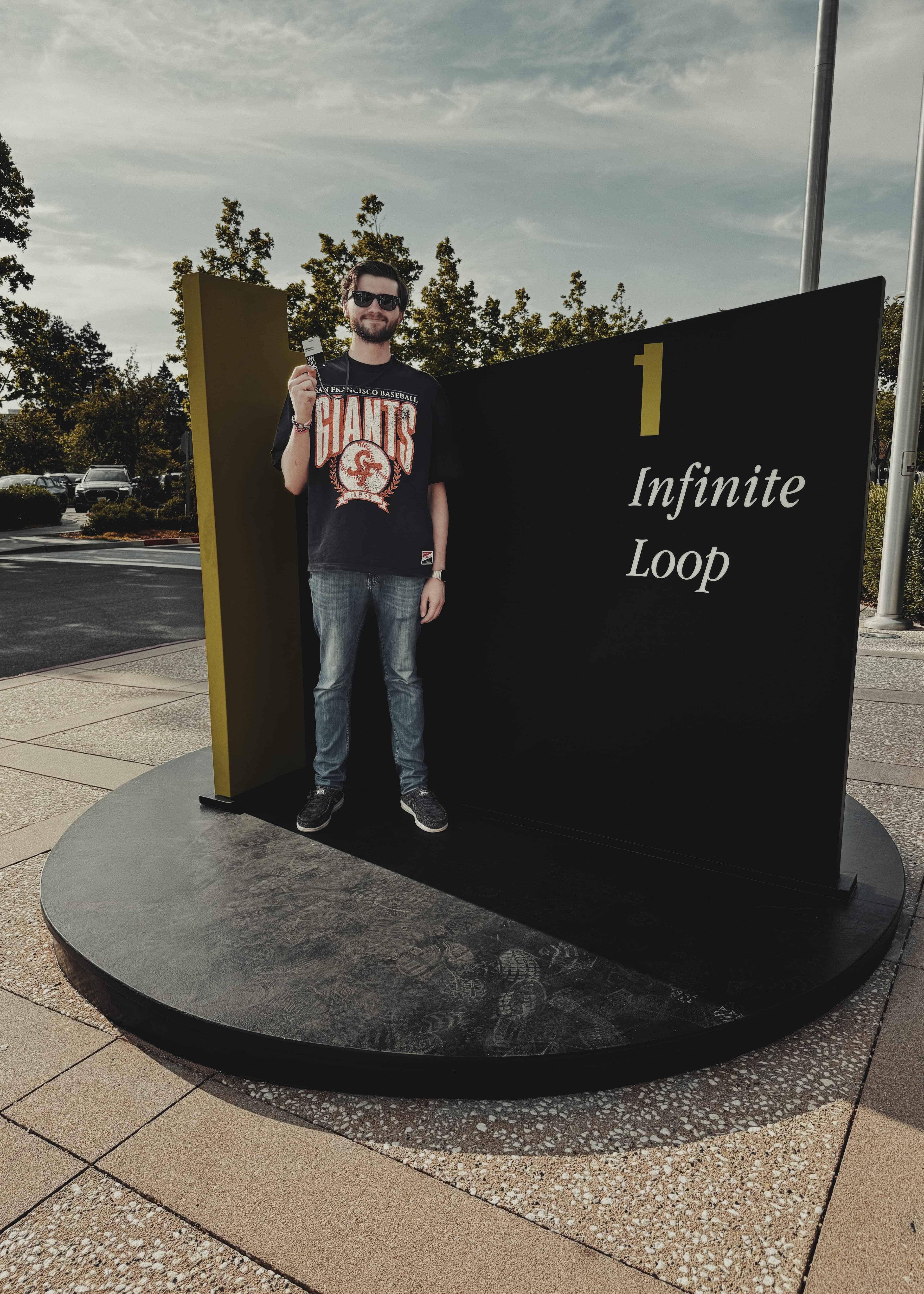 A photograph of the 1 Infinite Loop sign at Apple Campus.